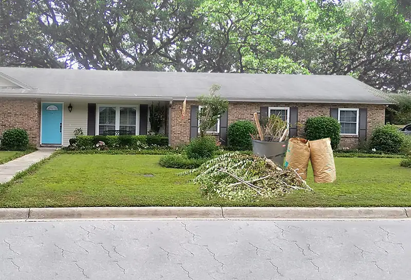 Cut branches and paper yard-waste bags piled on the front lawn of a brick ranch house